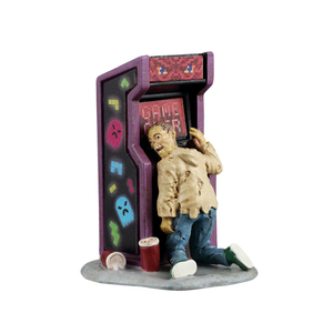 Figurine of a zombie playing an arcade game with a purple cabinet on a white background